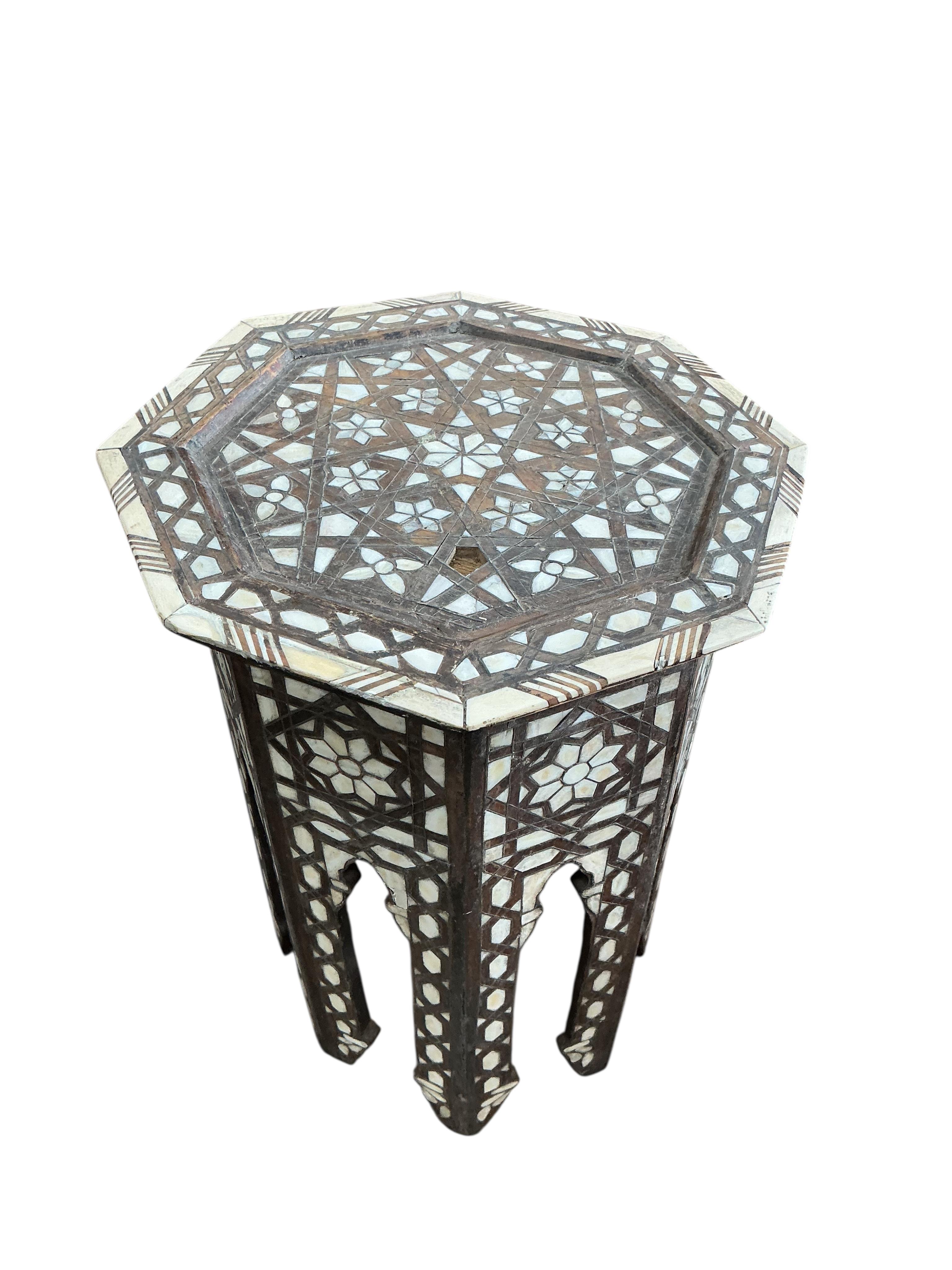 A near pair of octagonal bone inlaid Moorish occasional tables, width 39cm, height 55cm
